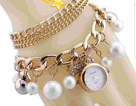 Ladies pearls braclet watch compressed